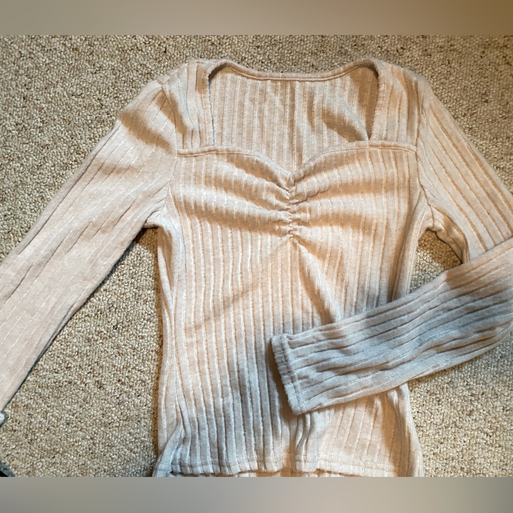 Small than long sleeve shirt. Like new.